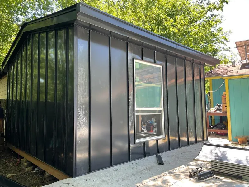 Black standing seam metal wall panels for Roof Inspection in Berlin